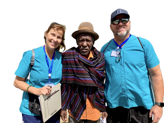 two volunteers nurses with a man