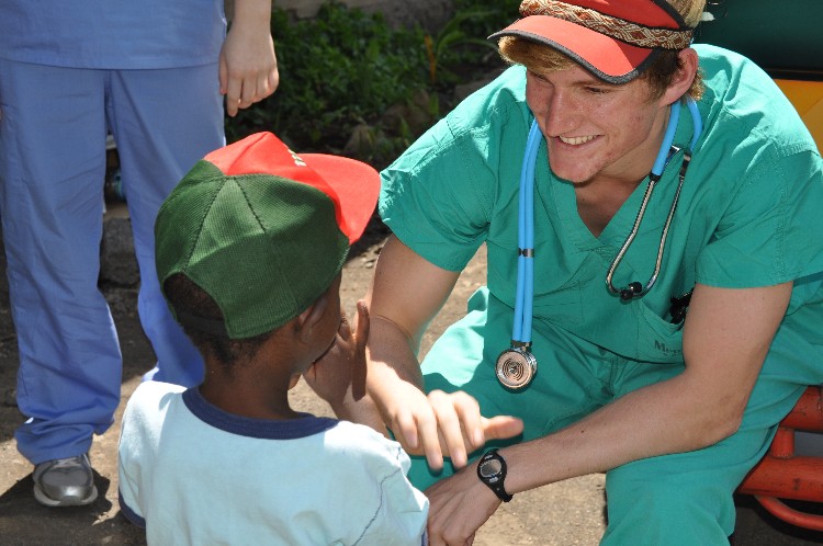 A doctor helping a small child in Tanzania