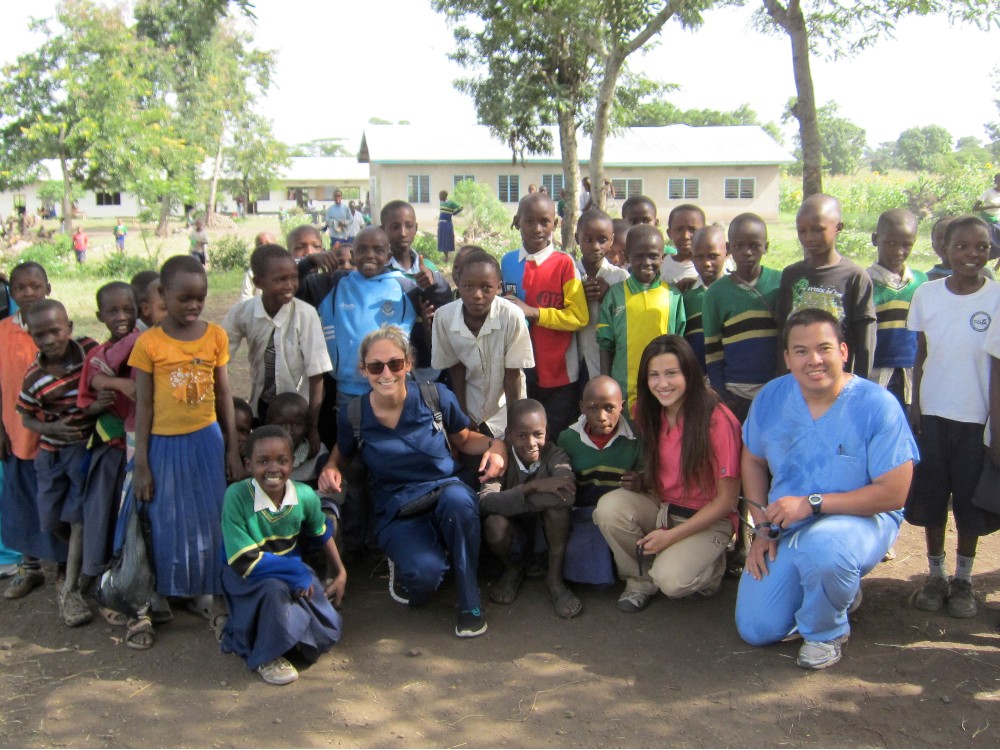 A group of Tanzania students and volunteers taking a group photo