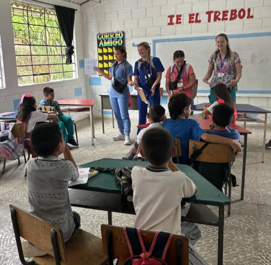 A group of volunteer teachers, teaching students in colombia