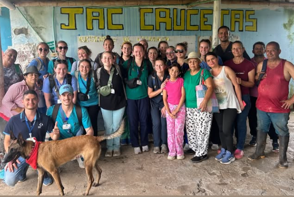 A group of locals and volunteers taking a photo together