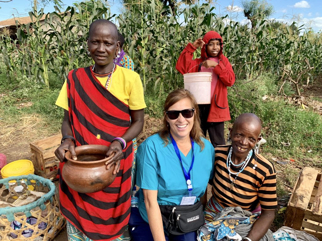 A ISL volunteer nurse helping Tanzania villagers